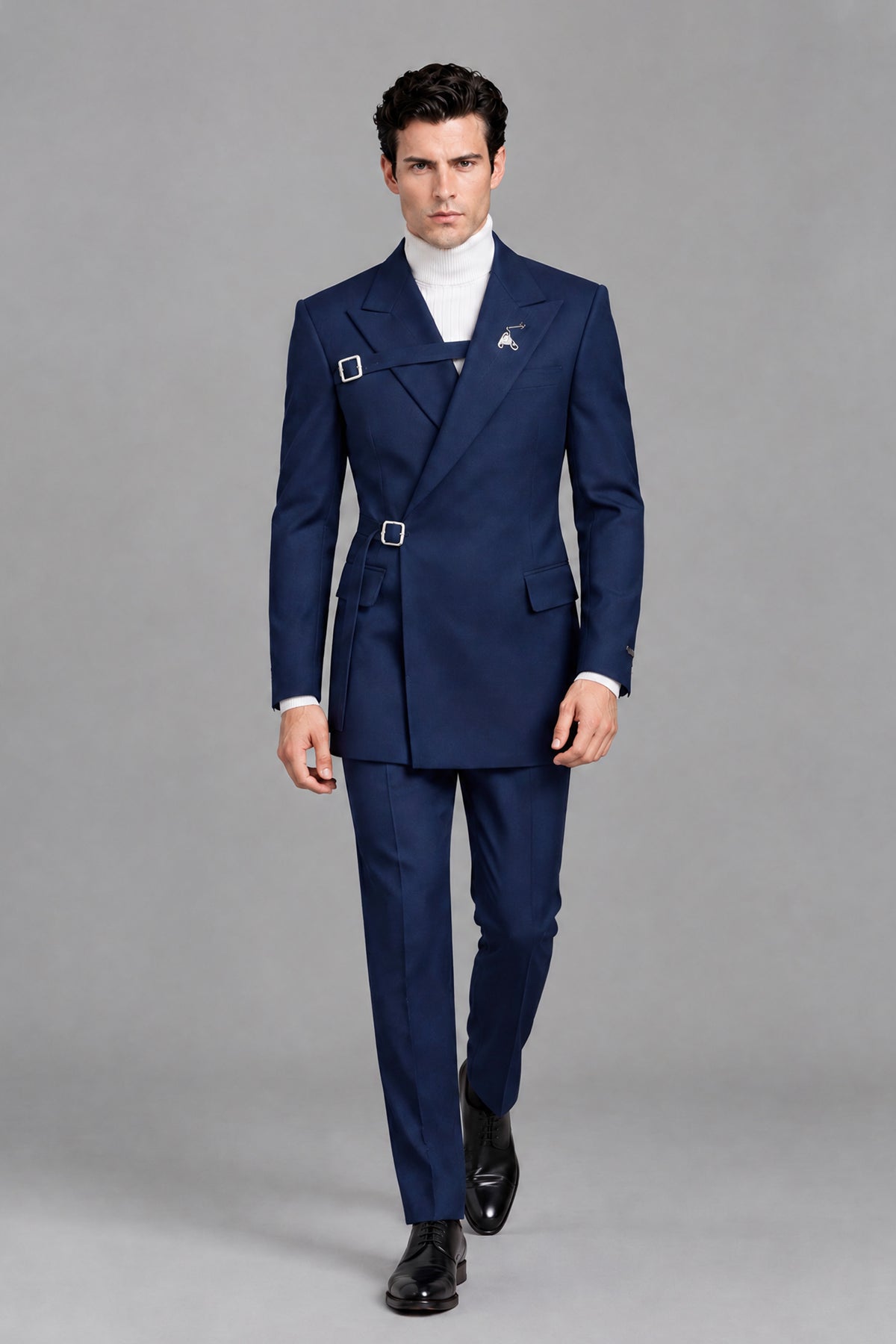 Close-up of Savile Men's Navy Blue Wrap Belted Jacket showing double buckle closure and peak lapel