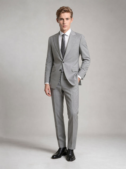 Savile GA0092 light grey wool suit – full body front view, hand in pocket with black brogue oxfords, white shirt and dark grey geometric tie