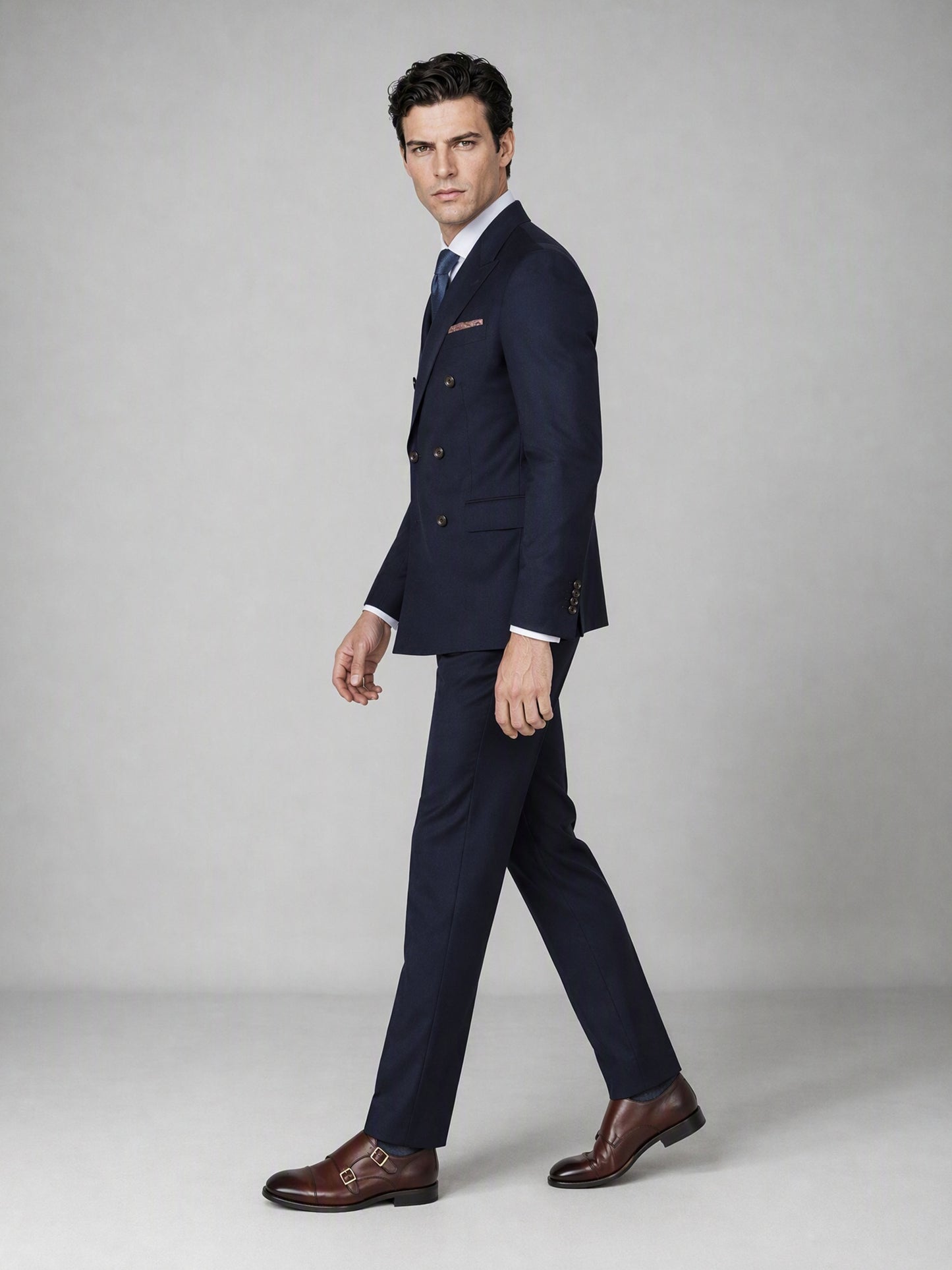 Men's Navy Blue Double-Breasted 3-Piece Suit – Side Walking View
