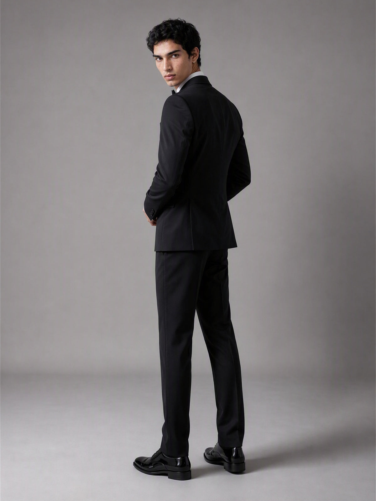 Savile GA0139 black double-breasted tuxedo suit set - rear three-quarter view showing clean back construction and slim trouser cut