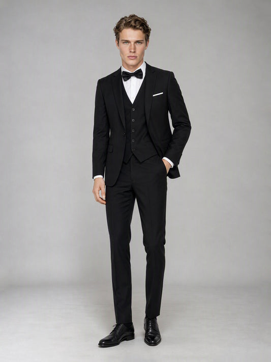 Savile GA0142 black suit - three-quarter side view showing peak lapel, single-breasted vest and French cuff detail