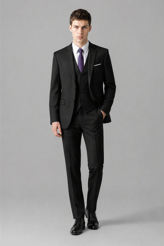 Savile Black 3-Piece Suit Set – Three-quarter front view, model adjusting jacket showing slim-fit silhouette