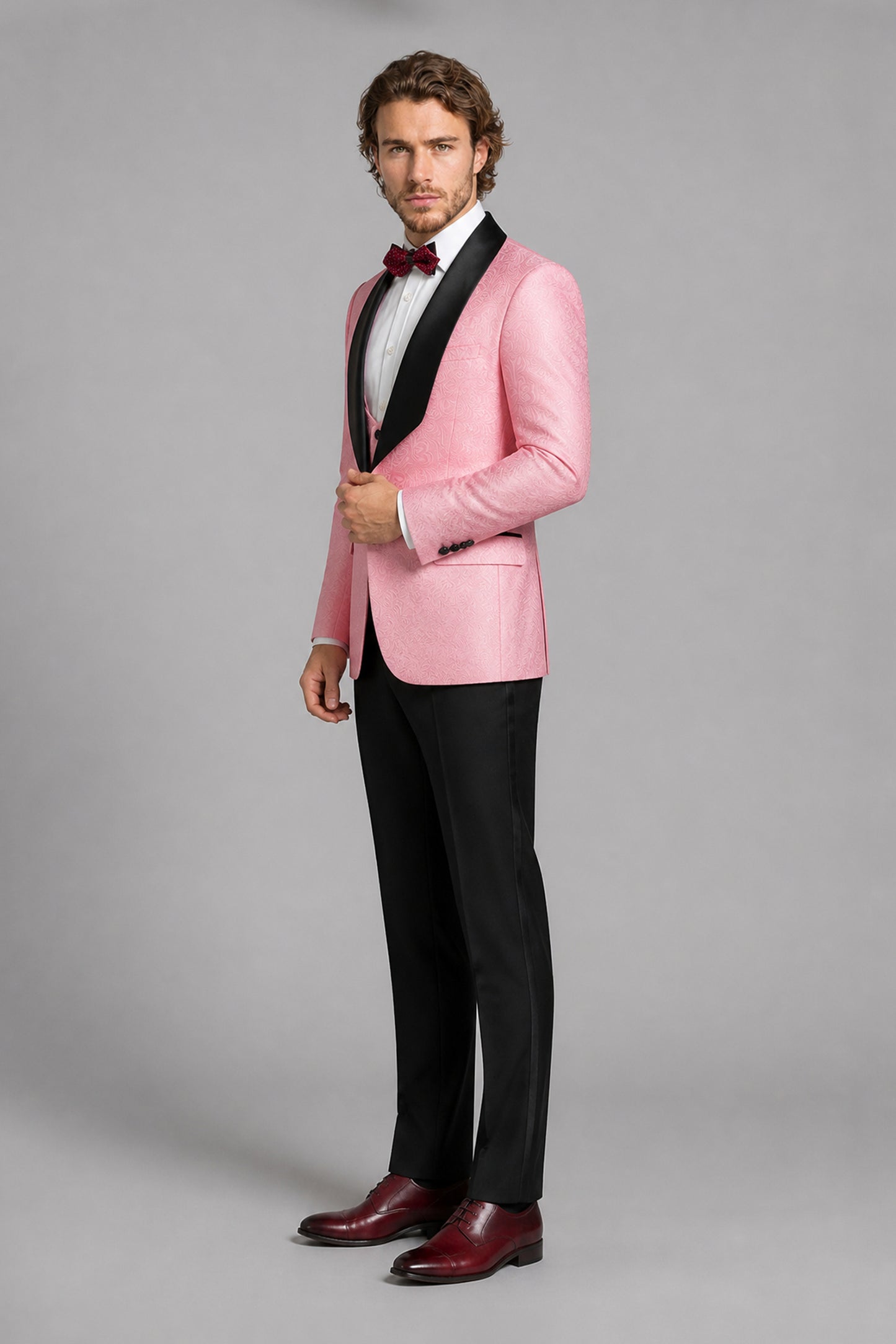 Savile Pink Jacquard 3-Piece Tuxedo Set – Three-quarter side view showing pink jacquard texture, satin lapel profile and tapered black trouser fit