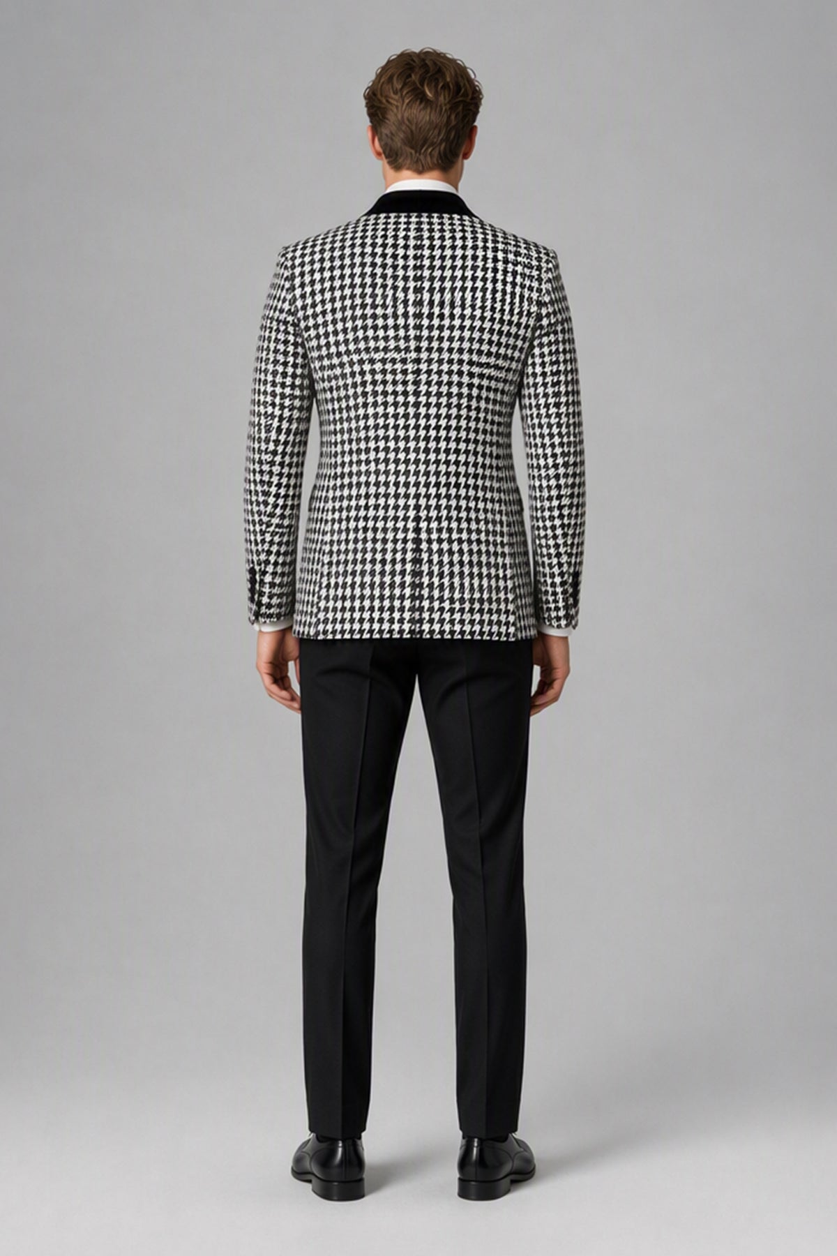 Man wearing Savile houndstooth tuxedo suit, back view
