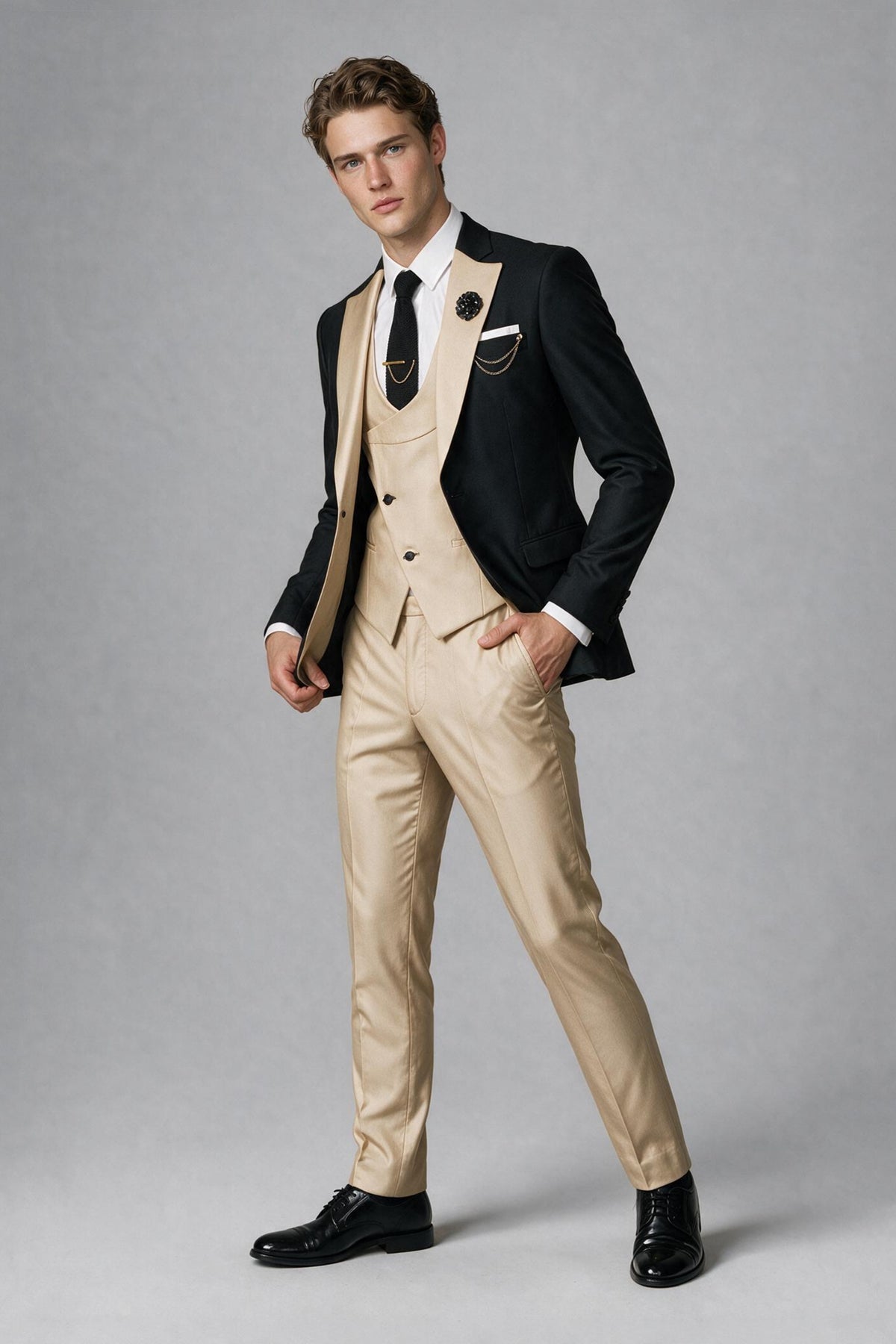 Walking full-length view of black jacket and beige trousers three-piece suit