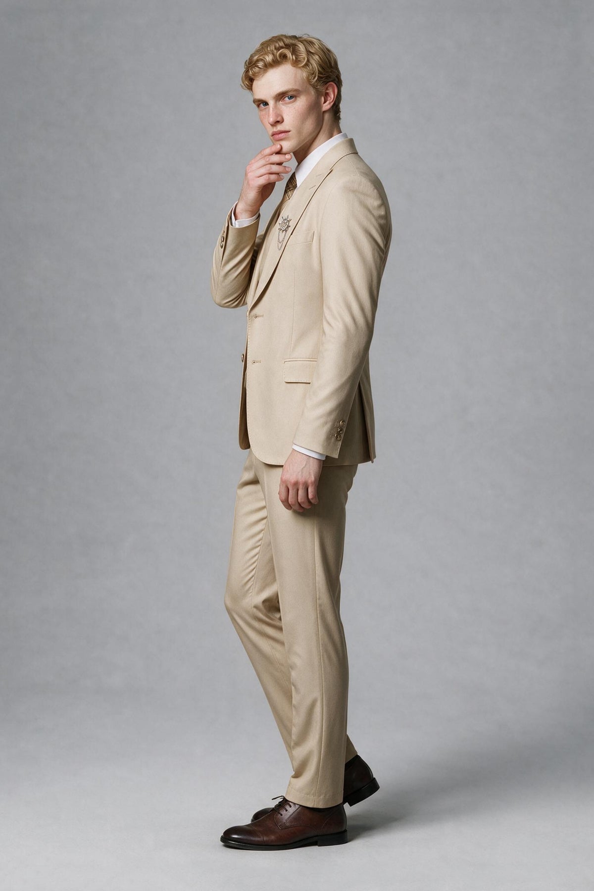 Side view of beige long-sleeve suit jacket and trousers