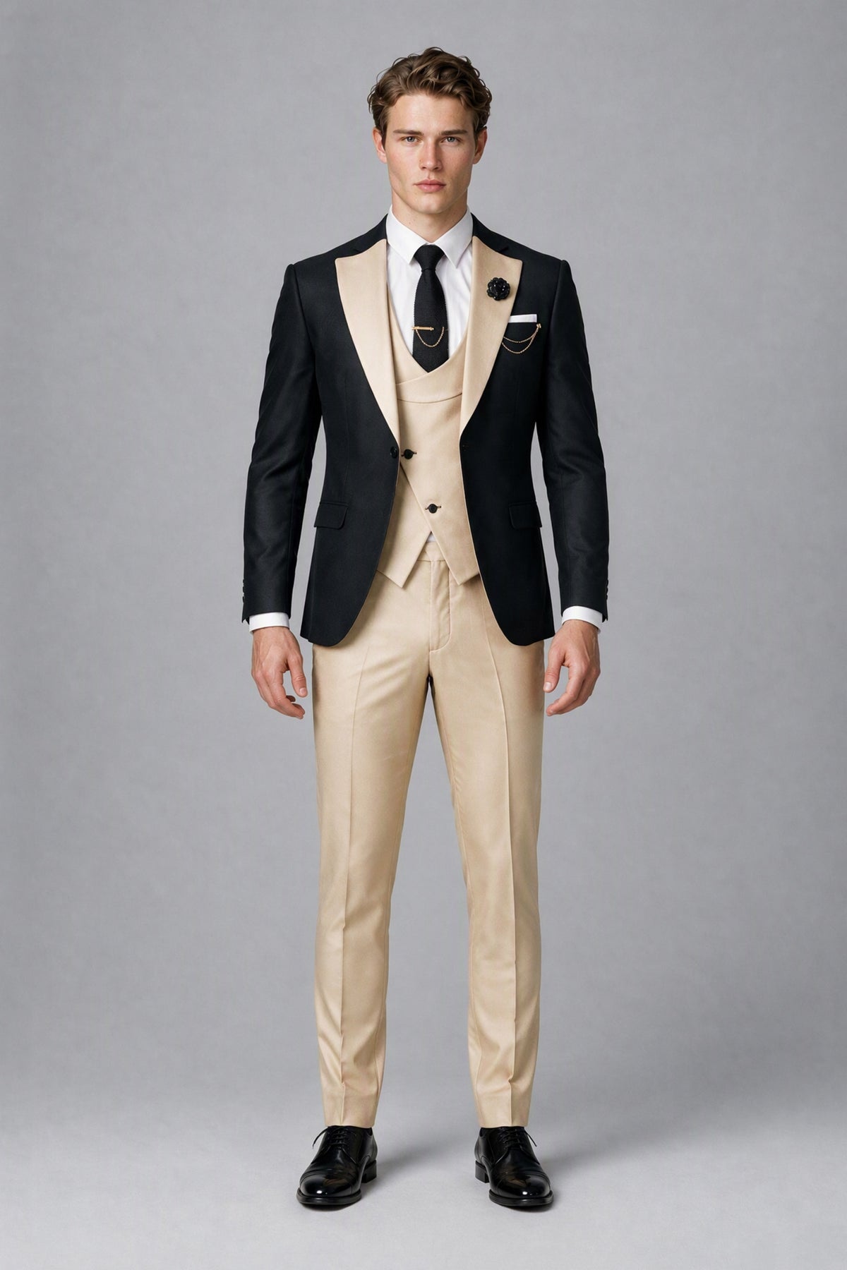 Front full-length view of Savile black jacket and beige waistcoat and trousers three-piece suit