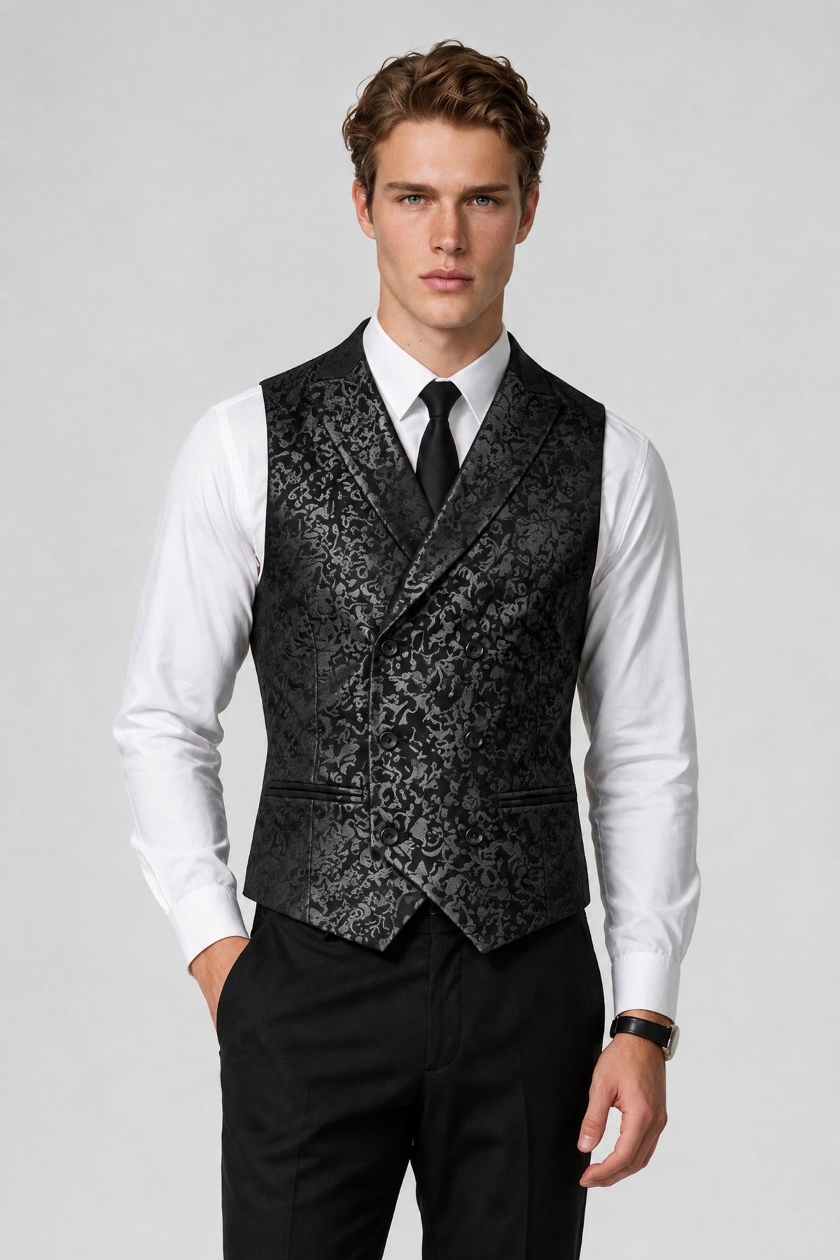Man wearing Savile black paisley jacquard vest with peak lapel, front view