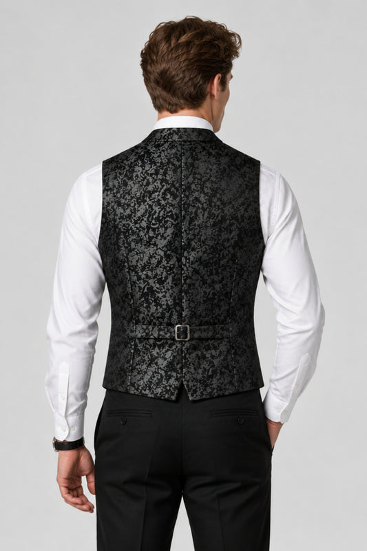 Man wearing Savile black paisley jacquard vest, back view showing adjustable strap