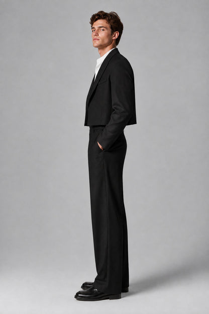 Side profile view of the Savile black cropped blazer and pleated wide-leg trousers
