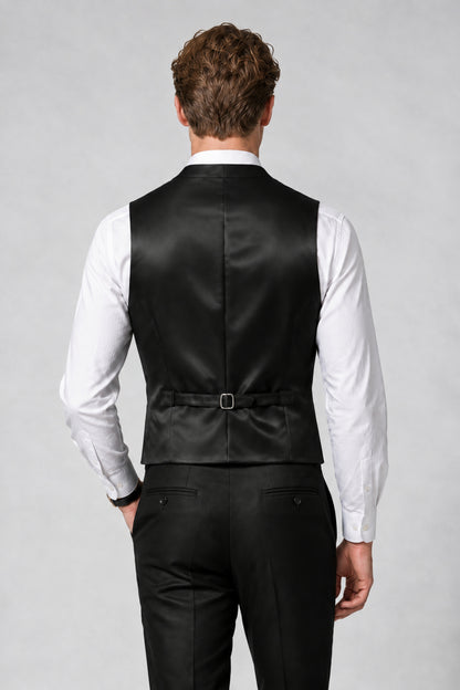 Man wearing Savile black satin vest, back view showing adjustable strap