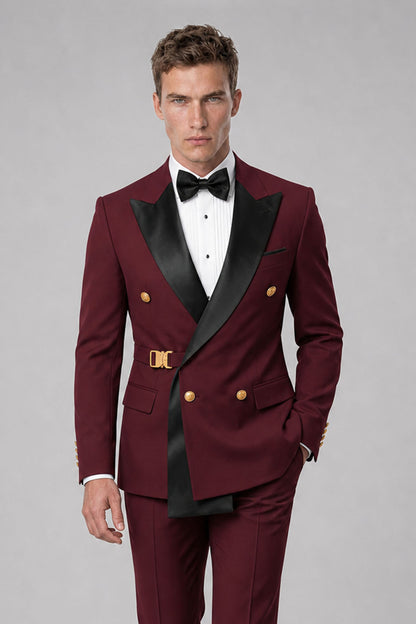 Close-up of Savile burgundy suit jacket with black peak lapels and gold-tone details