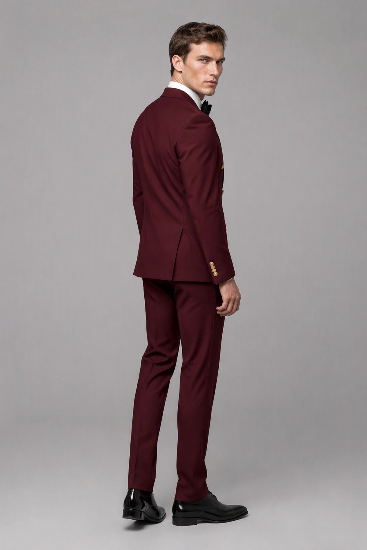 Rear three-quarter view of Savile burgundy suit jacket and matching trousers