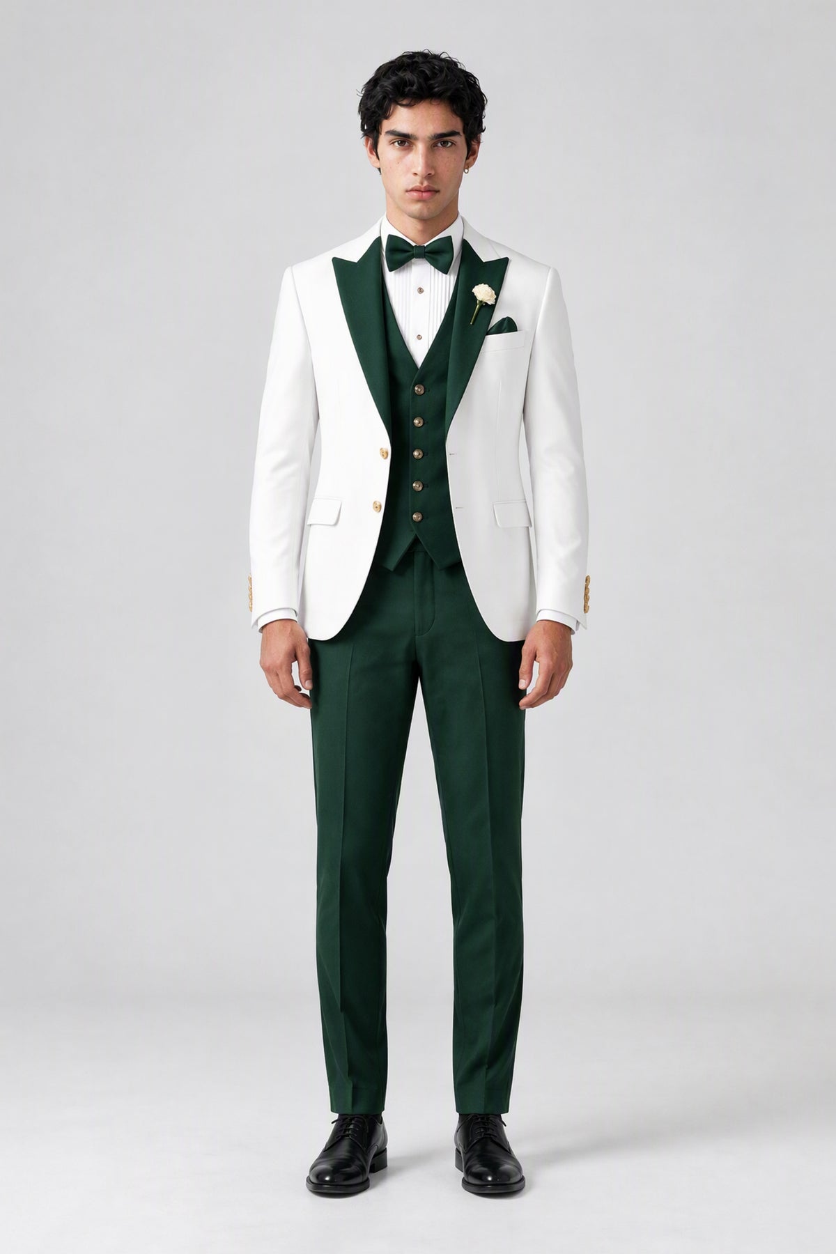 Close front view of white jacket and emerald green waistcoat