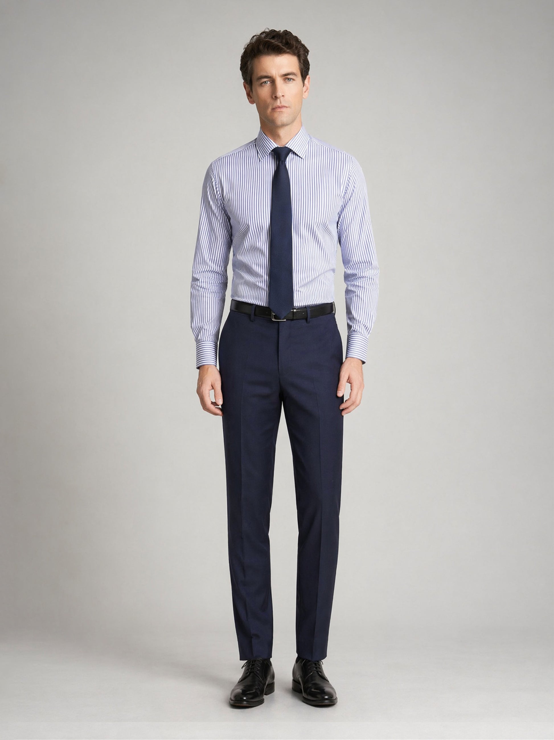 Men's navy blue suit trousers - front view with striped shirt and navy tie