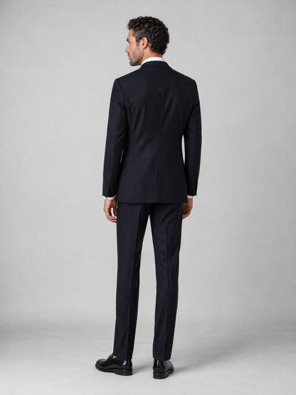 Men's navy double-breasted suit - back view showing jacket cut and full-length trouser