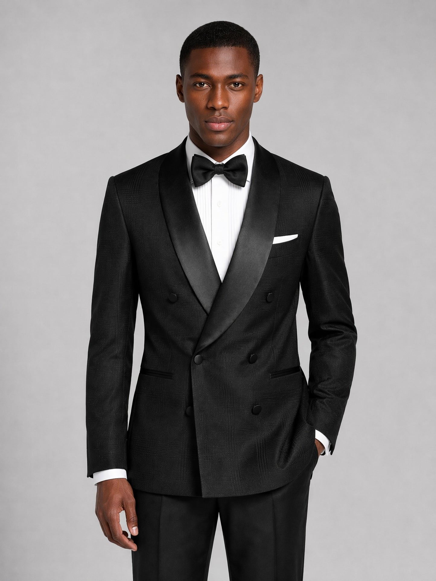Men's black tuxedo suit - upper body close up showing satin shawl lapel and bow tie detail