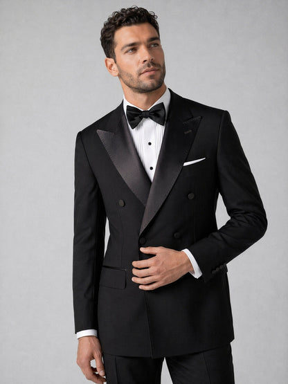 Men's black tuxedo suit - upper body close up showing satin peak lapel and six-button detail