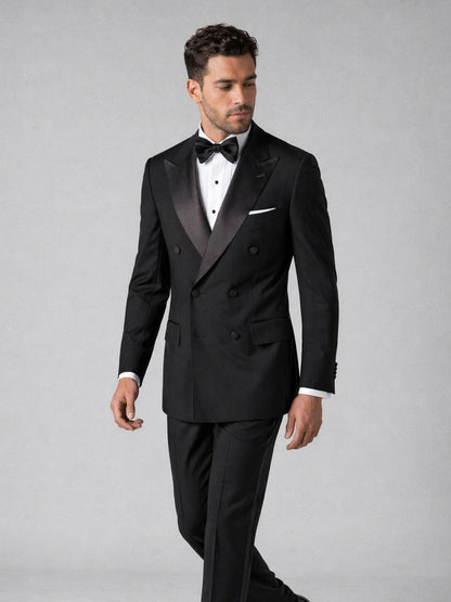 Men's black tuxedo suit - walking pose showing slim fit silhouette and trouser length
