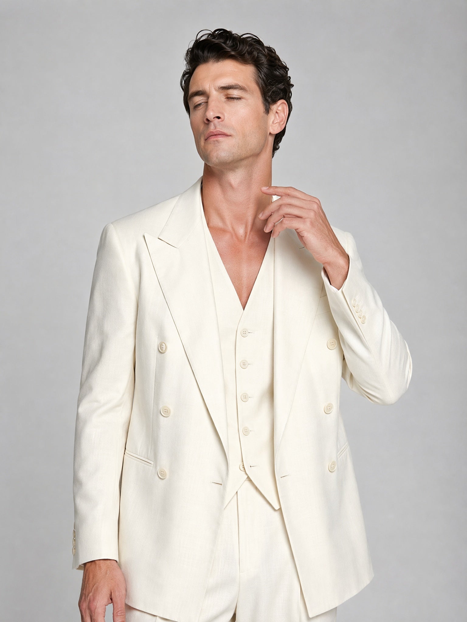Men's ivory double-breasted 3-piece suit - upper body close up showing peak lapel and vest detail