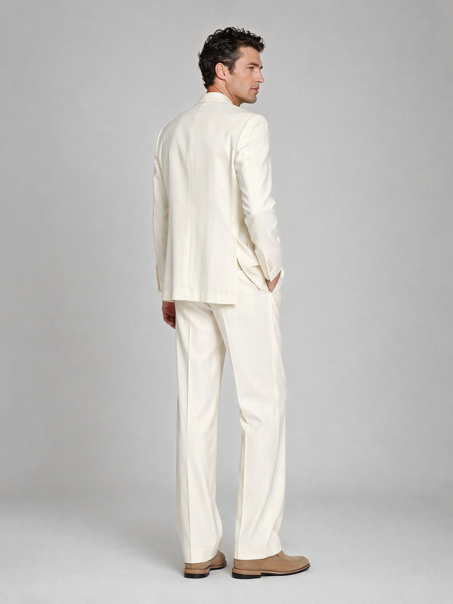 Men's ivory 3-piece suit - full length walking pose showing relaxed fit and trouser movement