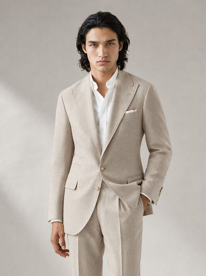 Savile GA0063 oatmeal linen suit set – three-quarter side pose, model adjusting collar showing relaxed Italian drape