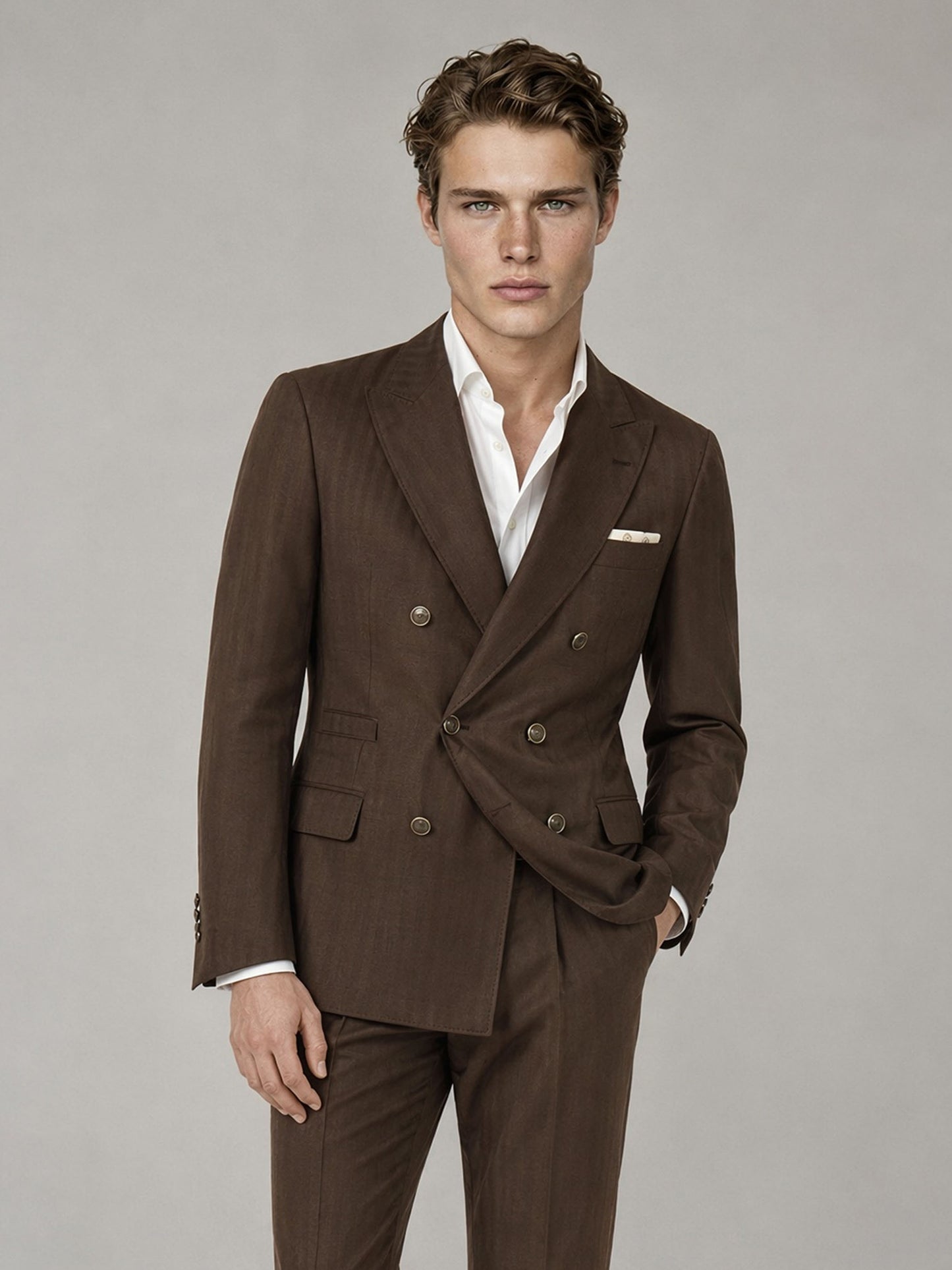 Savile GA0064 chocolate brown suit set – three-quarter side pose with navy tie showing peak lapel silhouette and slim trouser drape