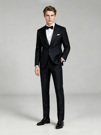 Savile GA0065 black peak lapel tuxedo – upper body front view showing satin peak lapel, pleated tuxedo shirt, black bow tie and white pocket square