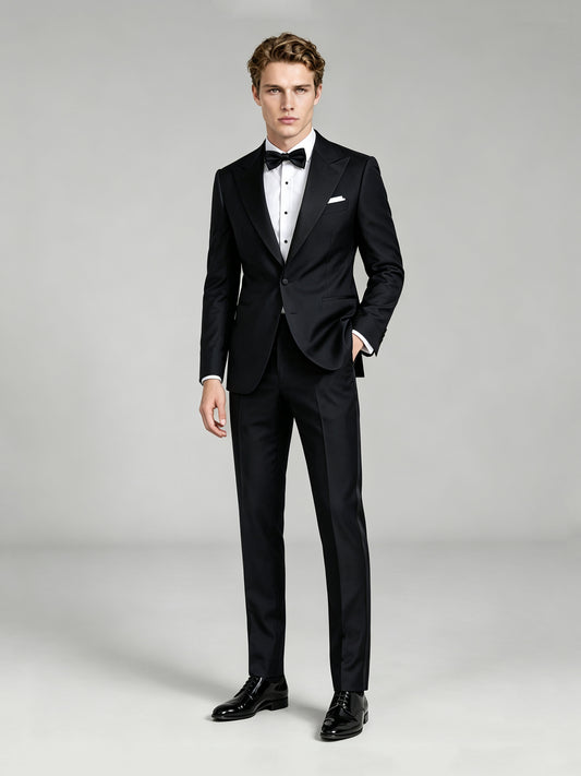 Savile GA0065 black peak lapel tuxedo – upper body front view showing satin peak lapel, pleated tuxedo shirt, black bow tie and white pocket square