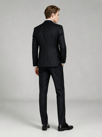 Savile GA0065 black peak lapel tuxedo set – full body front view, hands clasped showing slim silhouette and satin lapel detail