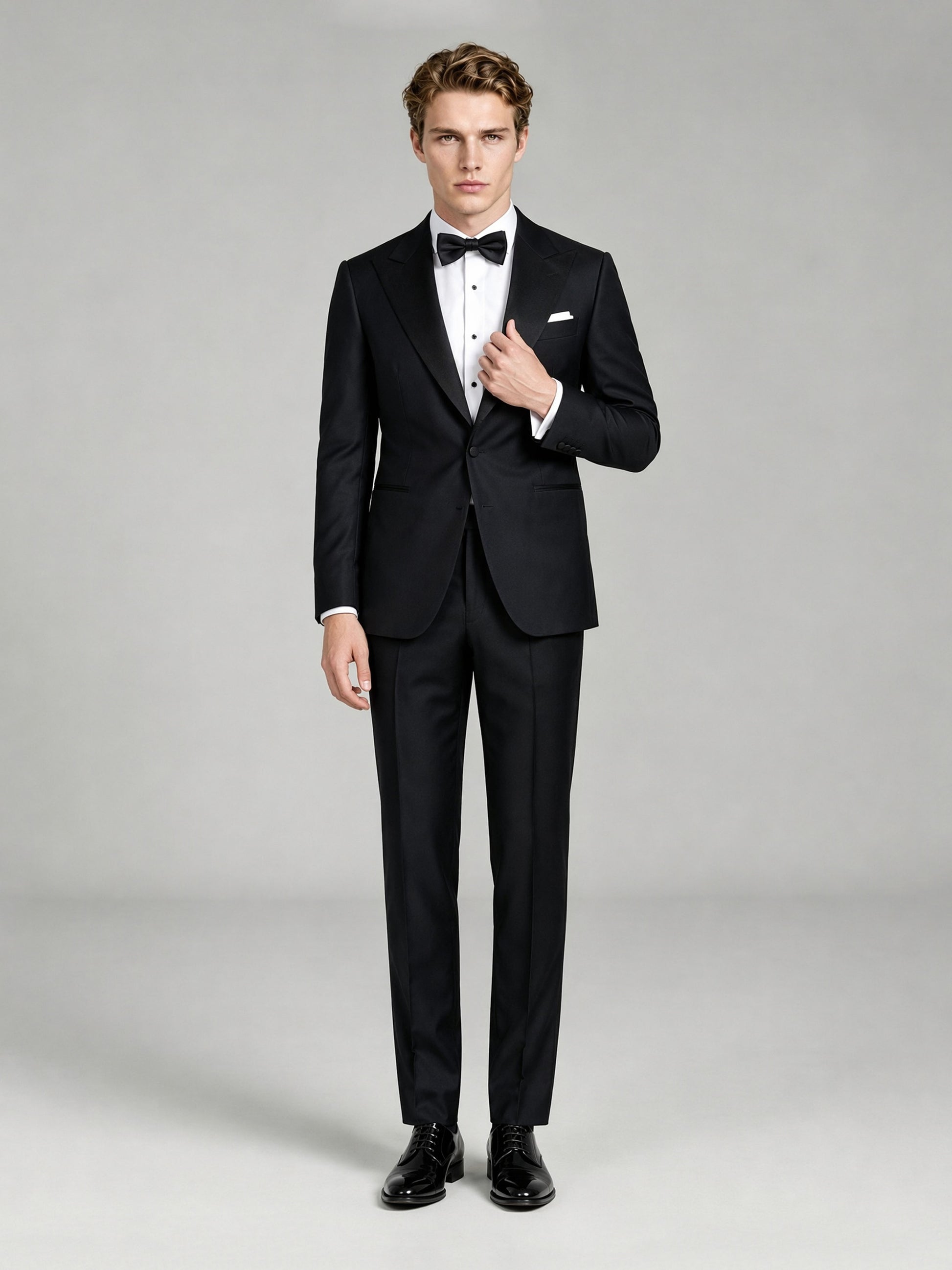 Savile GA0065 black tuxedo 3-piece set – back view showing center vent, structured shoulders and slim dress trousers with satin side stripe