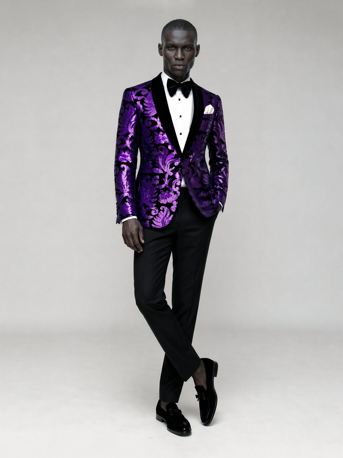 Savile GA0066 purple damask jacquard velvet tuxedo – upper body front view showing black velvet peak lapel, baroque floral pattern, pleated tuxedo shirt and black bow tie