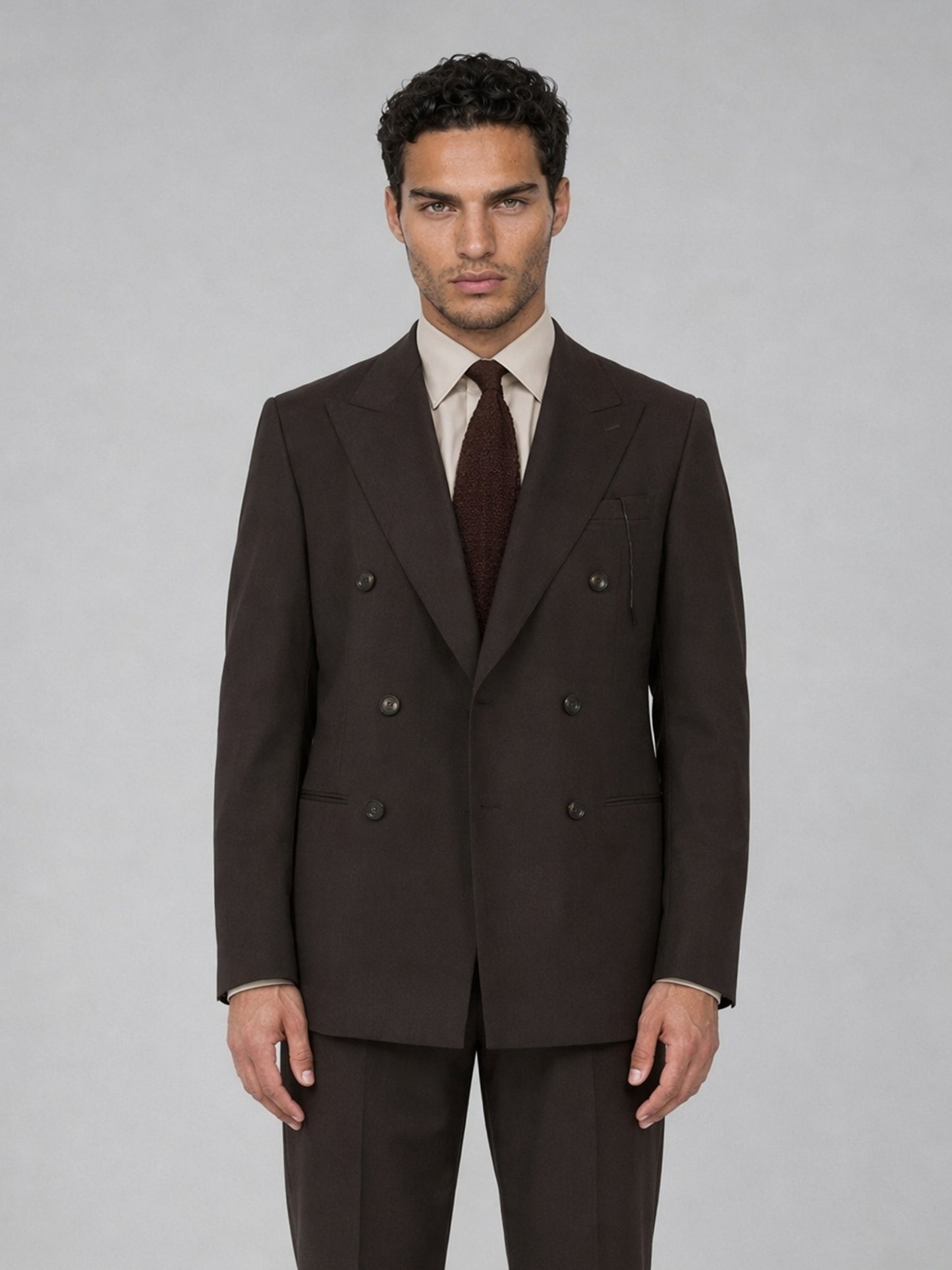 Savile GA0068 espresso brown suit set – three-quarter side pose with hand in pocket showing peak lapel profile and slim trouser line
