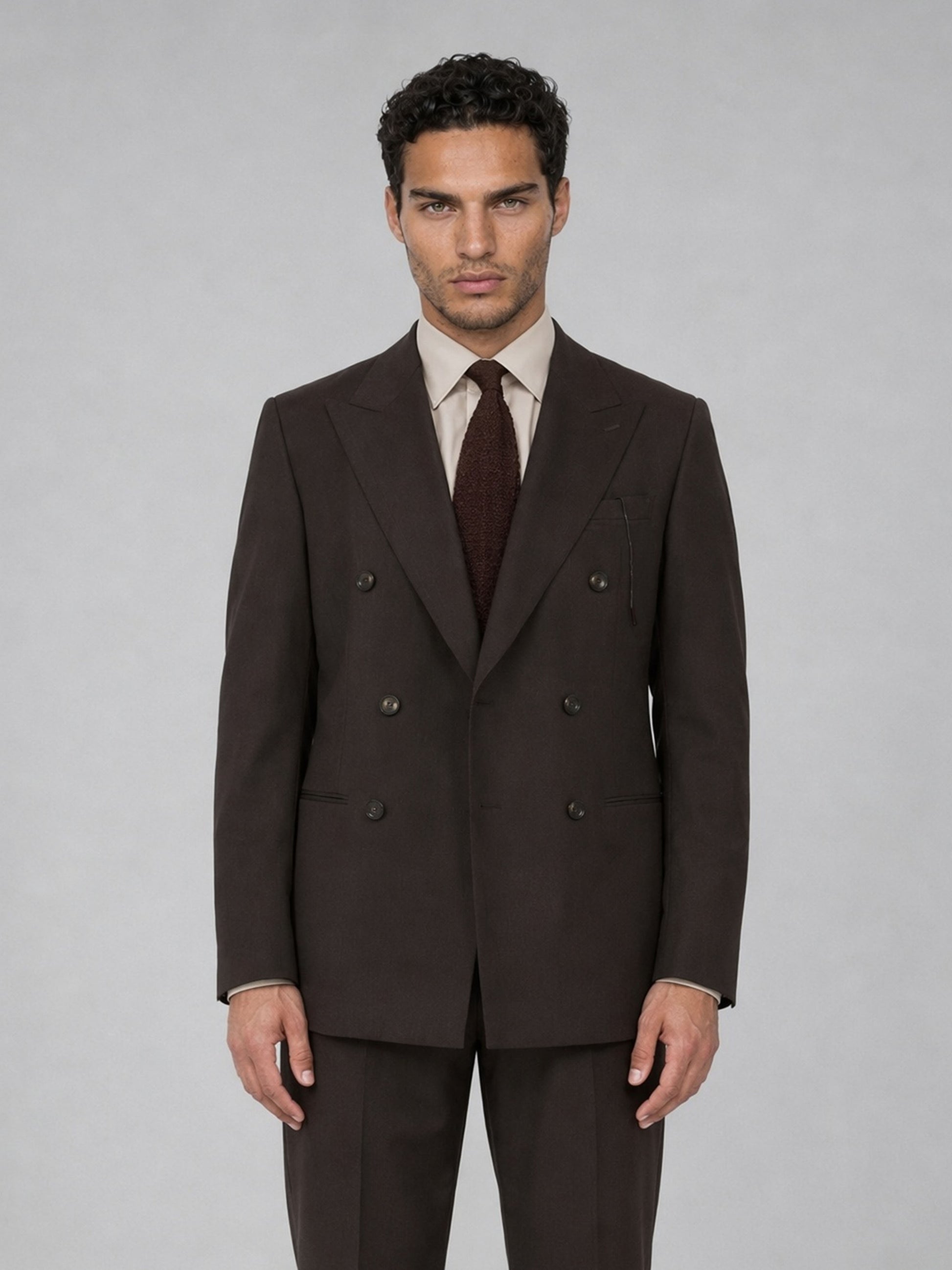 Savile GA0068 espresso brown suit set – three-quarter side pose with hand in pocket showing peak lapel profile and slim trouser line
