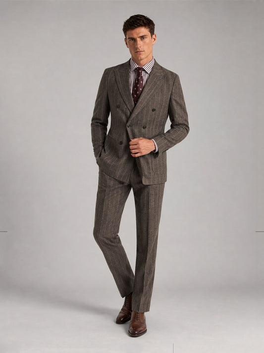 Savile GA0069 taupe chalk stripe double-breasted suit – full body three-quarter side pose, hands in pockets with brown oxford shoes and polka-dot tie