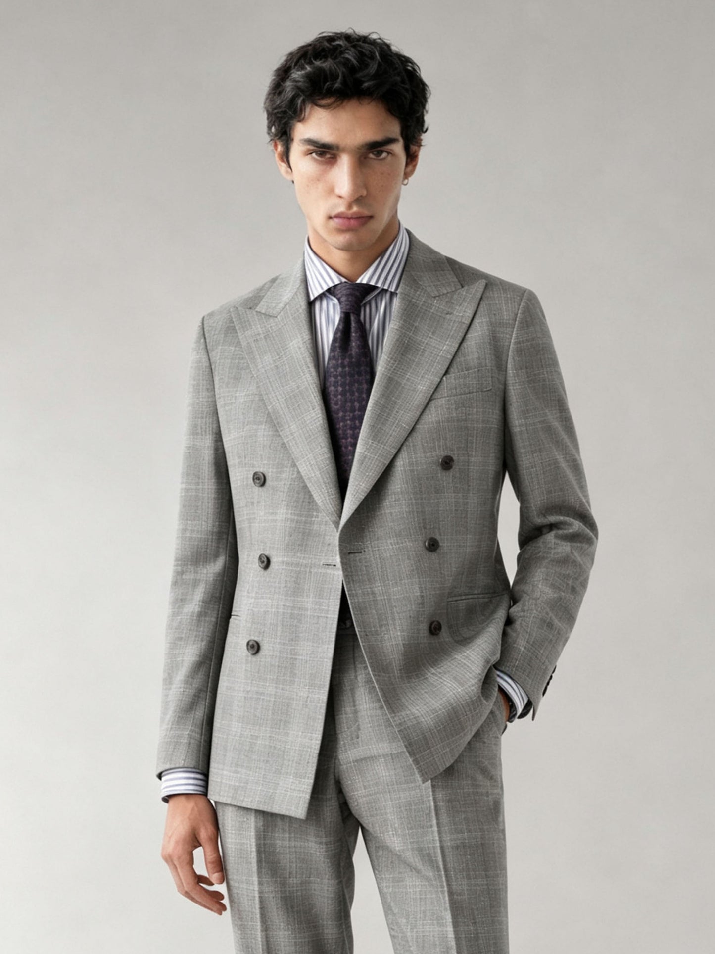 Savile GA0070 light grey glen plaid double-breasted suit – full body front view, hands in pockets showing relaxed confidence and slim silhouette