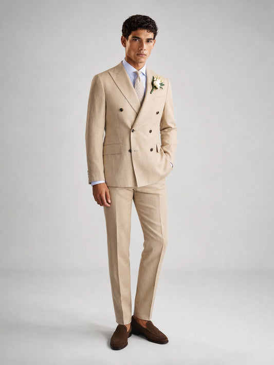 Savile GA0071 sand camel linen double-breasted suit – upper body front view showing peak lapel, six-button closure, white shirt, light blue tie and white boutonnière