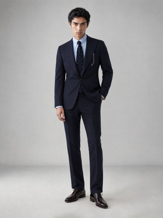Savile GA0076 midnight navy wool suit – upper body front view showing notch lapel, two-button closure, blue stripe shirt, navy polka-dot tie and white pocket square