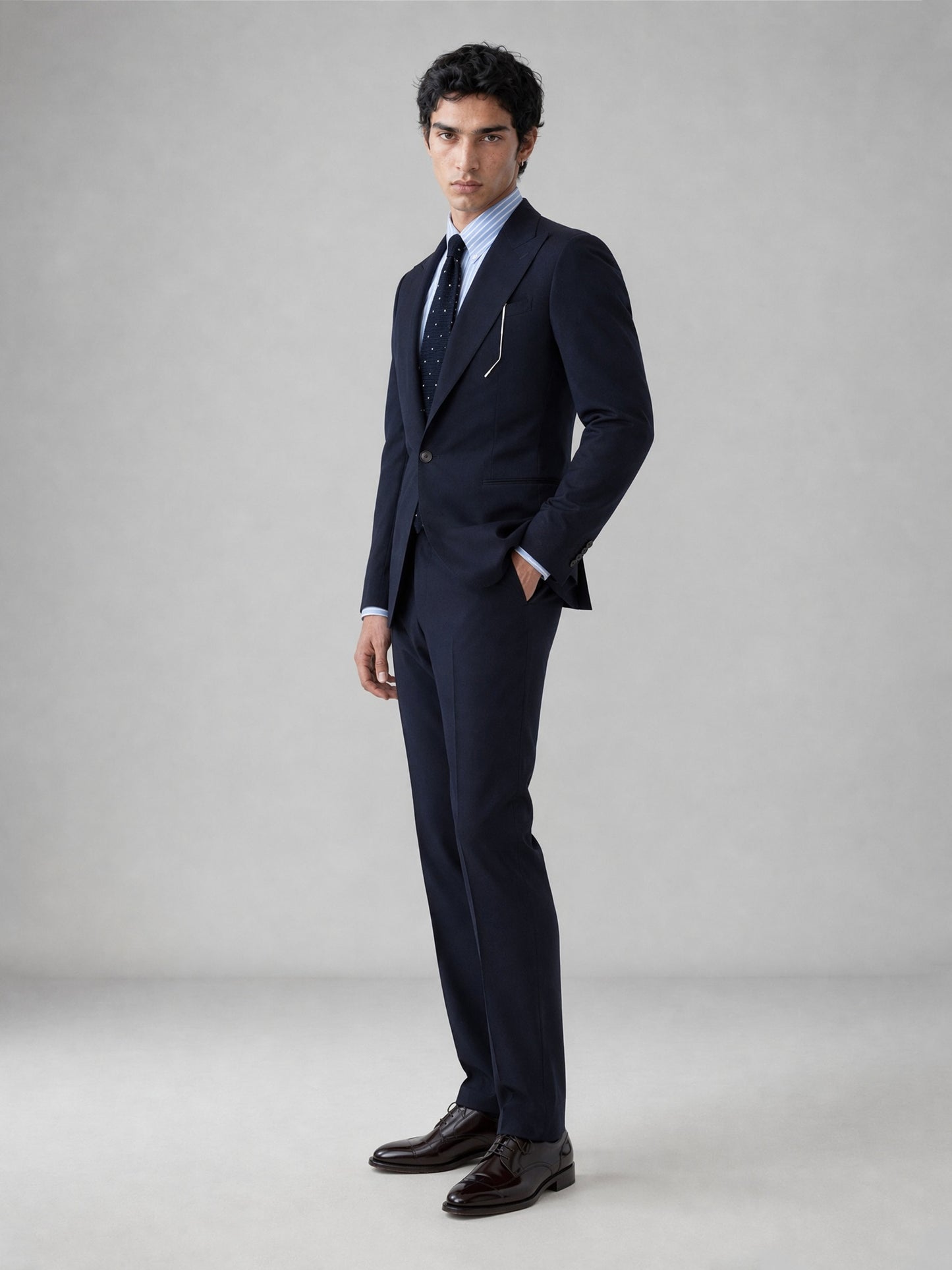 Savile GA0076 midnight navy suit set – back three-quarter view showing side vents, structured shoulders and slim trouser silhouette