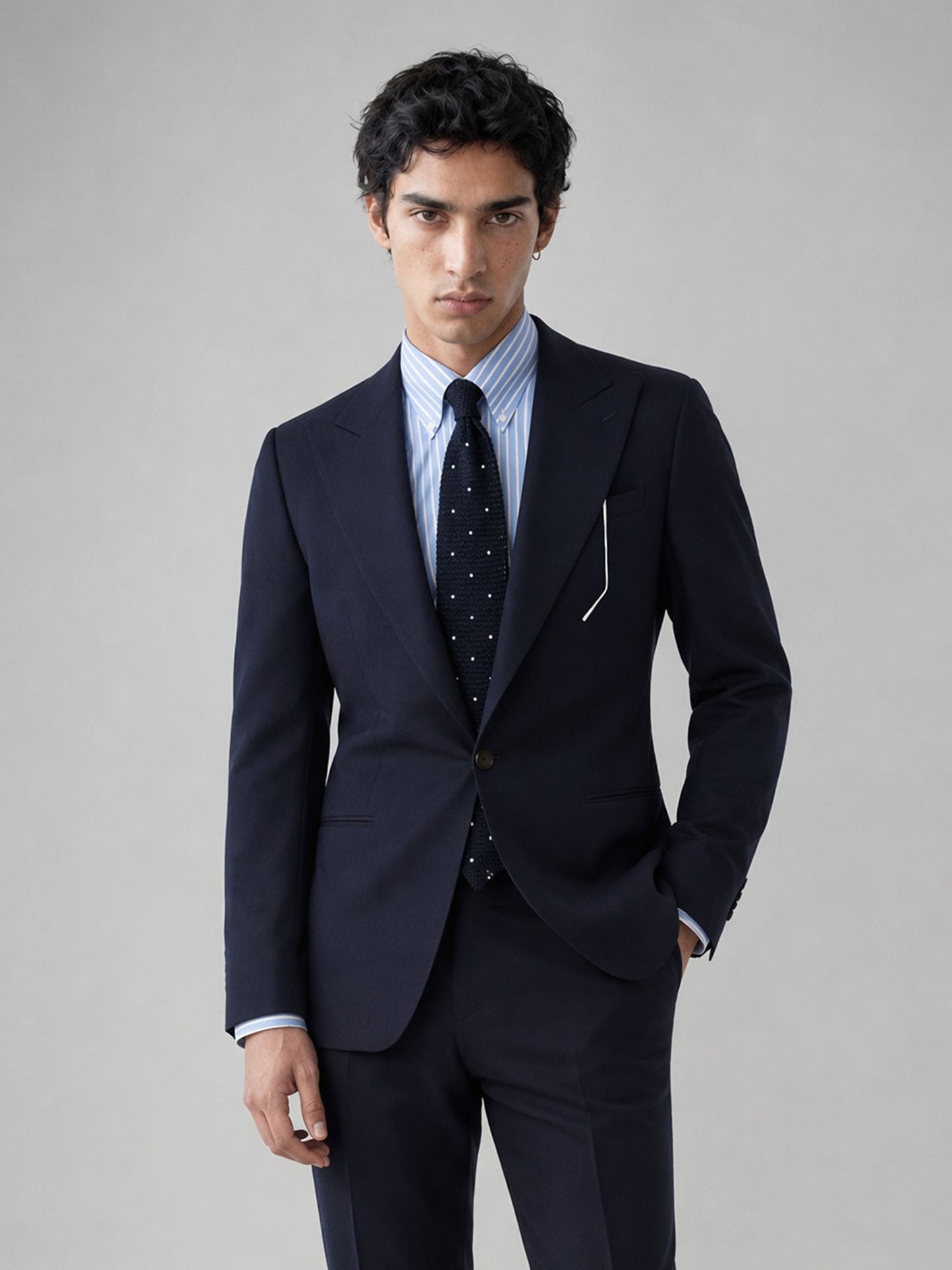 Savile GA0076 midnight navy wool 2-piece suit – full body three-quarter side pose, hand in pocket showing slim-fit silhouette and refined navy fabric
