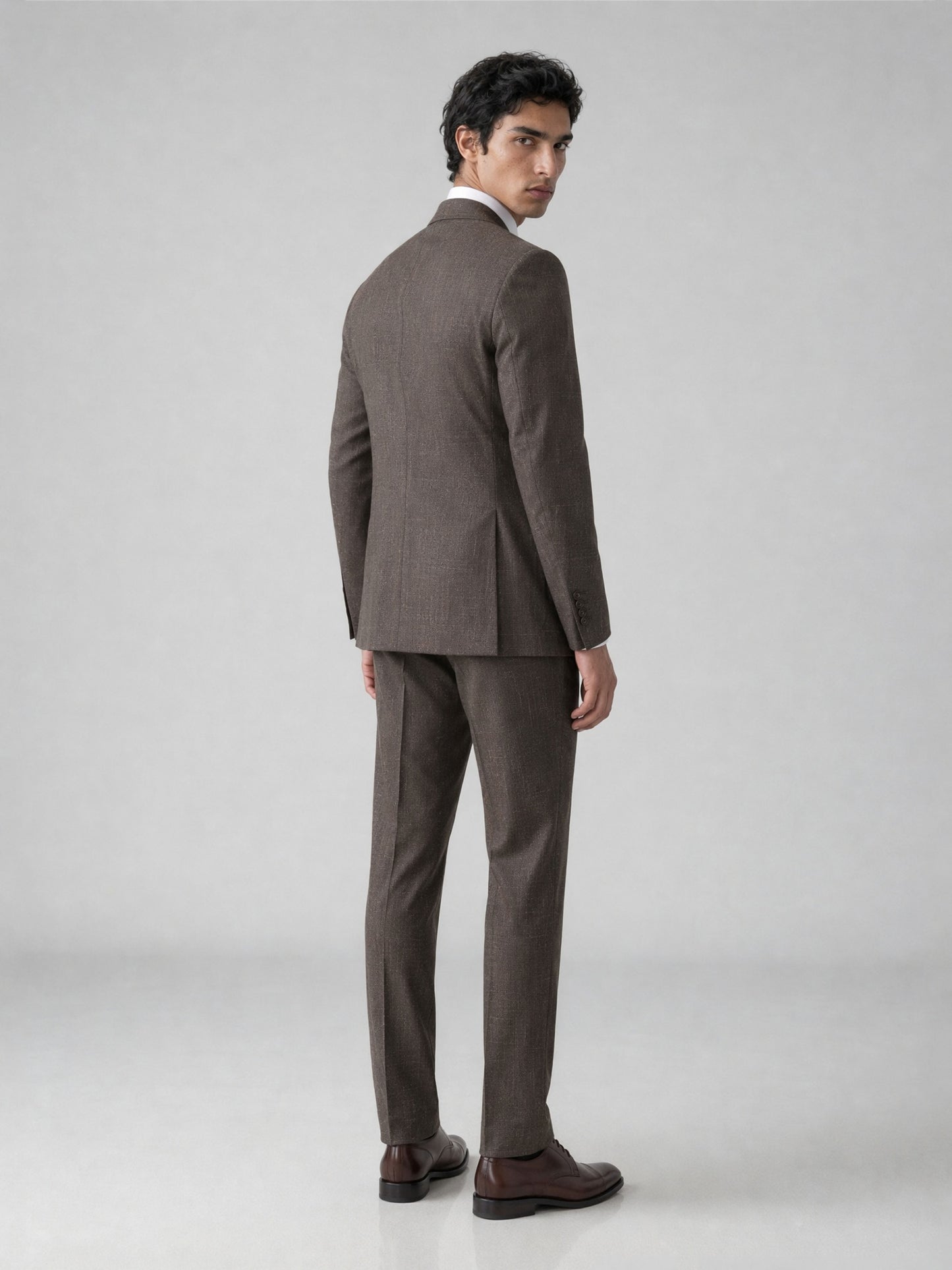 Savile GA0077 warm brown glen plaid suit – back view showing center vent, structured peak lapel shoulders and slim trouser drape