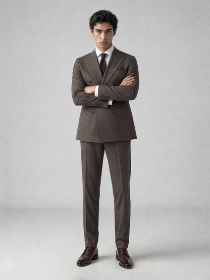 Savile GA0077 warm brown double-breasted suit – full body front view, arms crossed showing structured peak lapel silhouette and glen plaid fabric