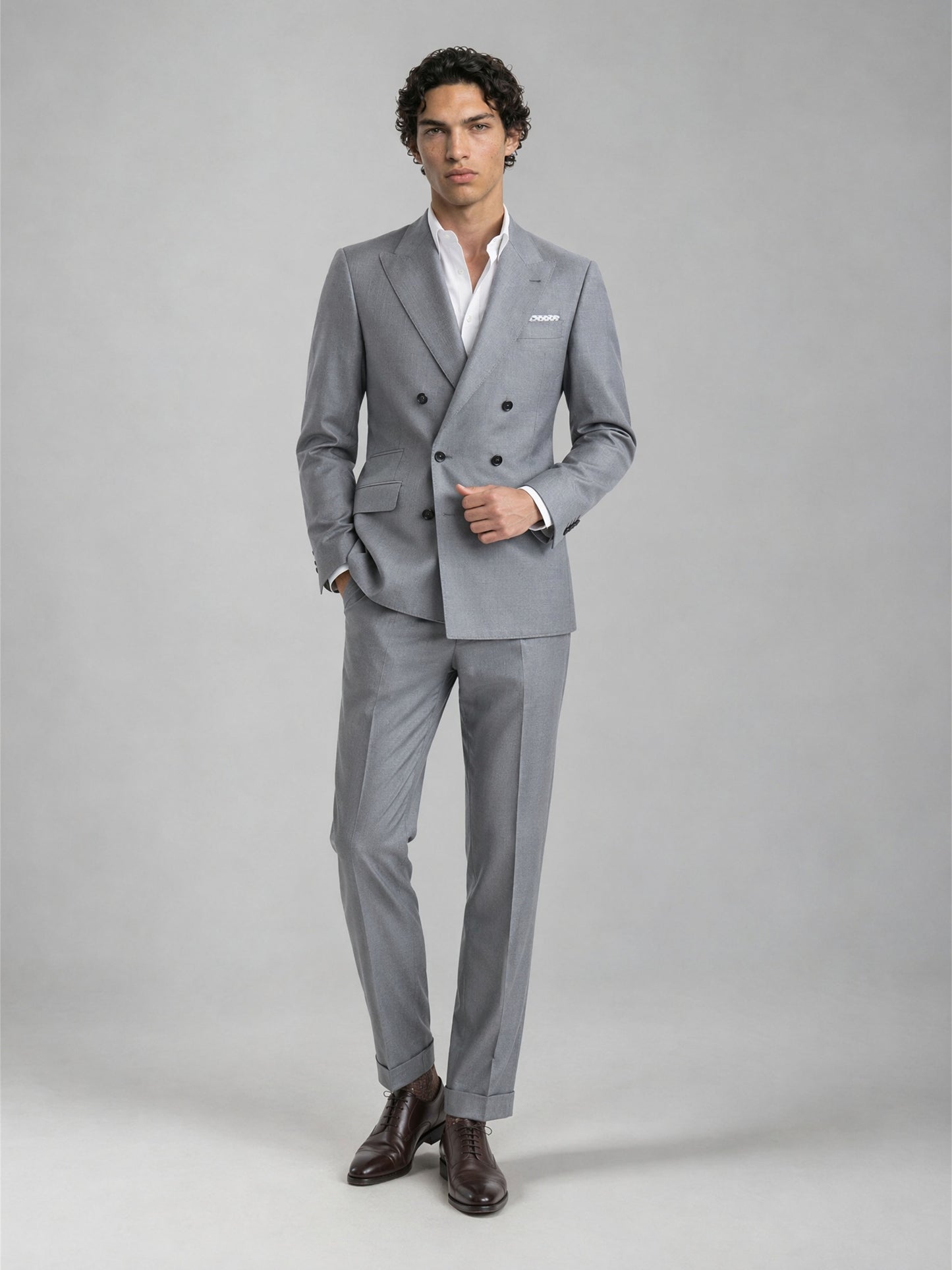 Savile GA0078 mid grey wool suit – upper body front view showing peak lapel, six-button double-breasted closure and white pocket square detail