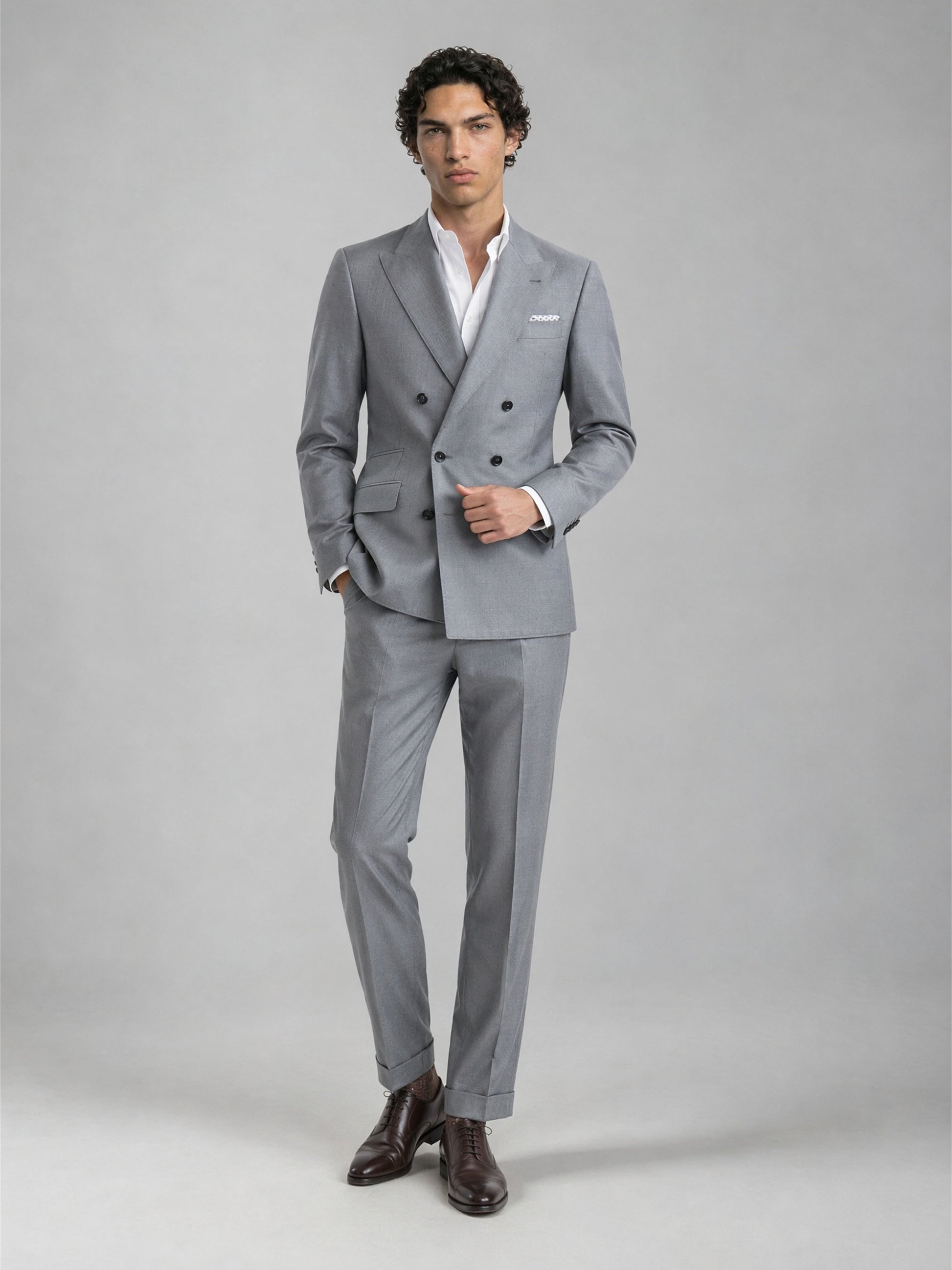 Savile GA0078 mid grey wool suit – upper body front view showing peak lapel, six-button double-breasted closure and white pocket square detail