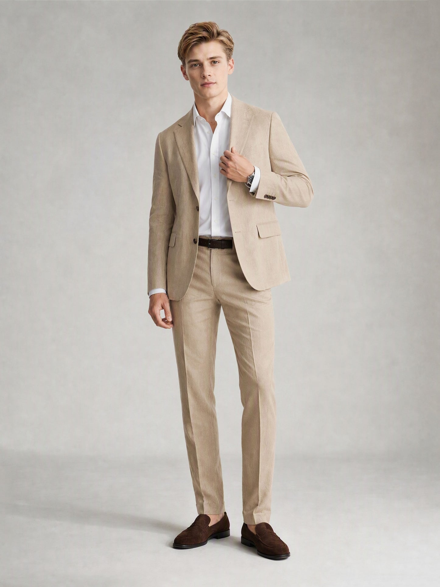 Savile GA0081 sand khaki suit – full body front view, hand touching lapel showing Italian drape and slim trouser silhouette