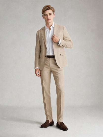 Savile GA0081 sand khaki suit – full body front view, hand touching lapel showing Italian drape and slim trouser silhouette