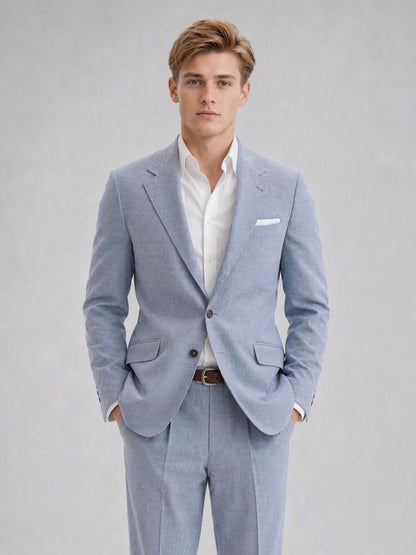 Savile GA0082 powder blue linen 2-piece suit set – full body front view, hands in pockets with white sneakers showing turn-up trouser cuffs and slim silhouette