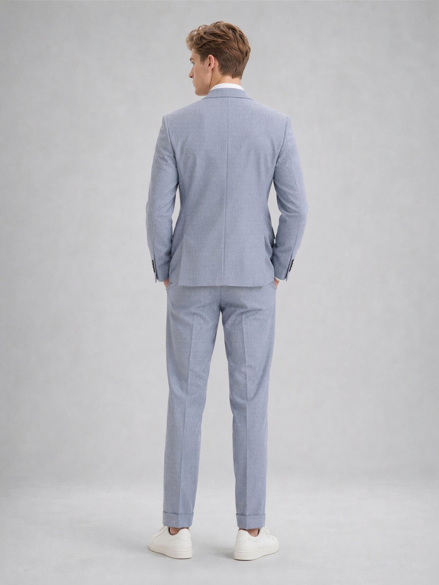 Savile GA0082 powder blue linen 2-piece suit – full body front view, arms crossed showing structured peak lapel silhouette and slim turn-up trouser drape