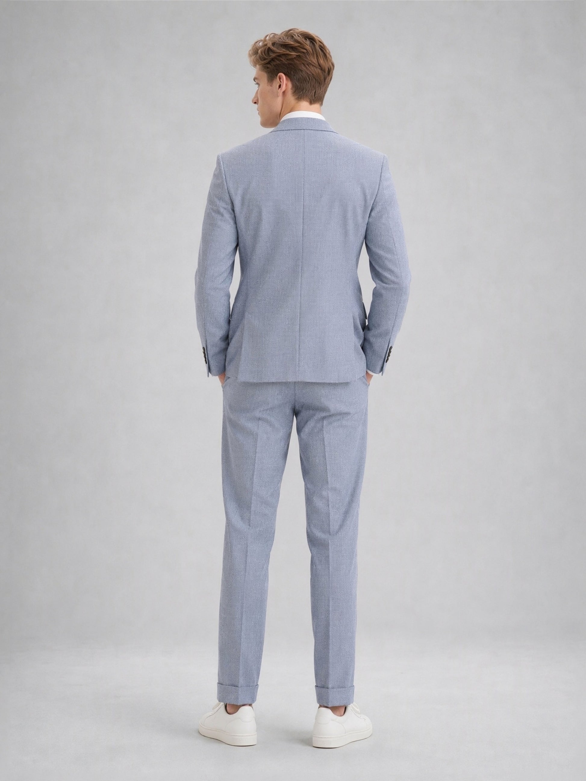 Savile GA0082 powder blue linen 2-piece suit – full body front view, arms crossed showing structured peak lapel silhouette and slim turn-up trouser drape