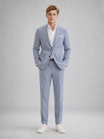 Savile GA0082 powder blue linen suit set – back view showing side vents, structured shoulders and slim turn-up trouser silhouette with white sneakers